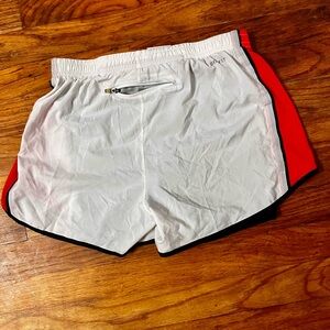 Nike White Athletic Shorts with Red Side Panels